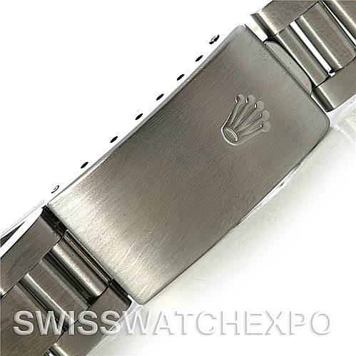 This image shows a close-up of the clasp and part of the bracelet of a Mid-Size Rolex watch.