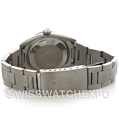 The image shows the back of a Rolex Mid-Size 68240 Women's Stainless Steel Pink Dial 68240 Women's Stainless Steel Pink Dial watch, highlighting the clasp and the case back.