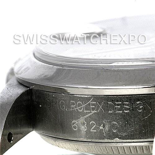 The image shows a close-up angle of the side of a Mid-Size Rolex watch, displaying the engraved model information and design details.