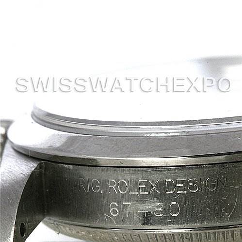 The image shows a close-up side view of a Rolex Mid-Size 67480 Women's Stainless Steel Black Dial 67480 Women's Stainless Steel Black Dial model's case, highlighting the "Rolex Design" engraving.