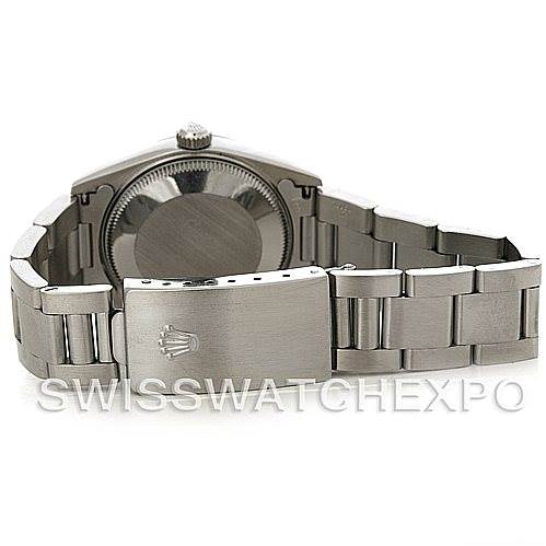 This image shows the back and the bracelet clasp of a Mid-Size Rolex watch.