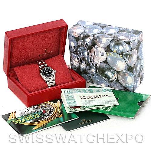 The image shows a Mid-Size Rolex watch in its open red box, with the outer packaging and accompanying booklets displayed nearby.