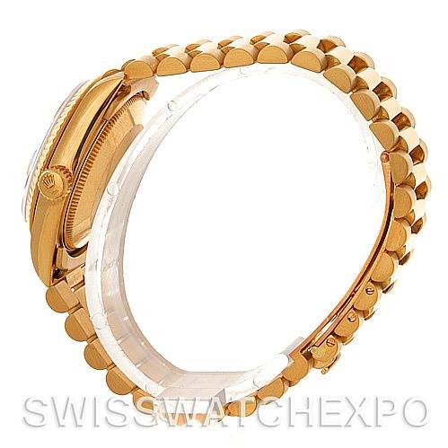 The image shows a side profile of a Rolex Mid-Size 68273 Women's Yellow Gold White Dial 68273 Women's Yellow Gold White Dial model watch, highlighting the gold bracelet, crown, and part of the case.