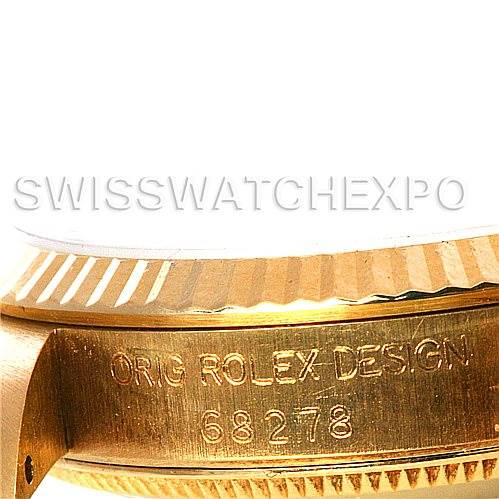 The image shows a close-up of the side of a Mid-Size Rolex watch, highlighting its fluted bezel and engraved model number "68278".