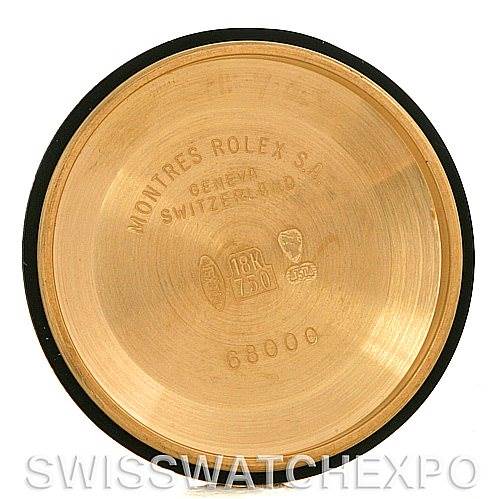 This image shows the inside of the case back for a Mid-Size Rolex watch, displaying engravings and quality stamps.