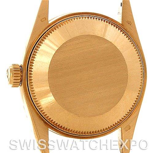 The image shows the case back and crown of a Rolex Mid-Size 68273 Women's Yellow Gold White Dial 68273 Women's Yellow Gold White Dial model watch viewed from the rear.