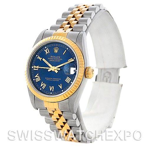 The image shows a Rolex Datejust 68273 Women's Stainless Steel Blue Dial 68273 Women's Stainless Steel Blue Dial watch at a three-quarter angle, highlighting its blue dial, fluted gold bezel, and two-tone bracelet.