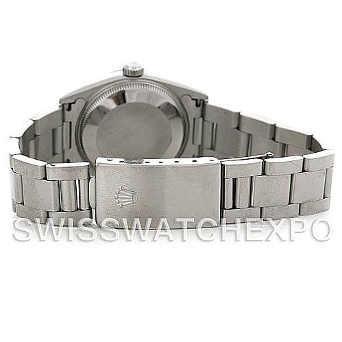 The image shows the back and clasp of a Mid-Size Rolex watch, highlighting the bracelet and case back.