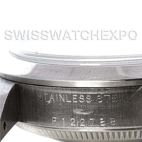 This image shows the side of a Rolex Mid-Size 78240 Women's Stainless Steel White Dial 78240 Women's Stainless Steel White Dial watch case with "Stainless Steel" and serial number engraving.