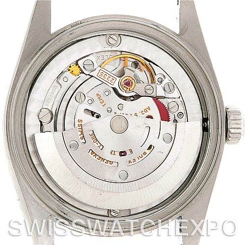 This image shows the internal mechanism of a Mid-Size Rolex watch from a rear angle with the back case removed.