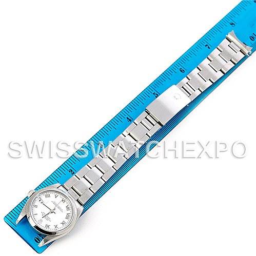 The Rolex Mid-Size 78240 Women's Stainless Steel White Dial 78240 Women's Stainless Steel White Dial watch is shown flat, alongside a ruler, displaying the face and full metal bracelet.