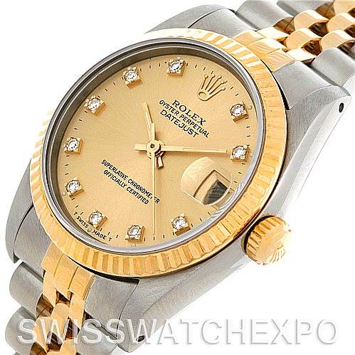 This image shows a Mid-Size Rolex Datejust watch from an angled view, highlighting its gold-tone bezel, dial, and two-tone bracelet.