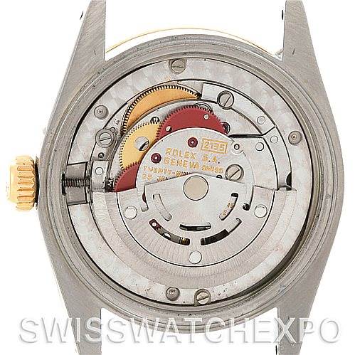 This image shows the inner mechanism and movement from the back of a Mid-Size Rolex watch.