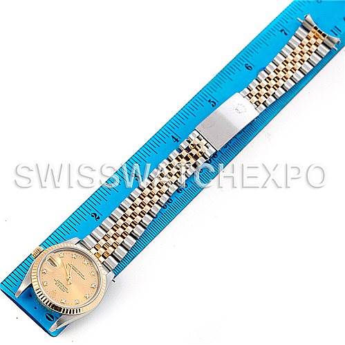 The image shows a Rolex Mid-Size 68273 Women's Stainless Steel Champagne Dial 68273 Women's Stainless Steel Champagne Dial watch laid flat with a ruler for scale, displaying the face, bezel, and full bracelet.