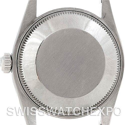 This image shows the back view of a Rolex Mid-Size 67514 Women's Stainless Steel Blue Dial 67514 Women's Stainless Steel Blue Dial watch, focusing on the case back and crown.