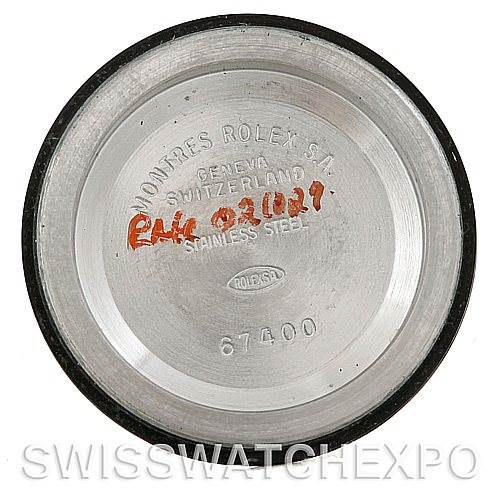 The image shows the inside of a Rolex Mid-Size 67514 Women's Stainless Steel Blue Dial 67514 Women's Stainless Steel Blue Dial watch case back, displaying engraved model and branding details.