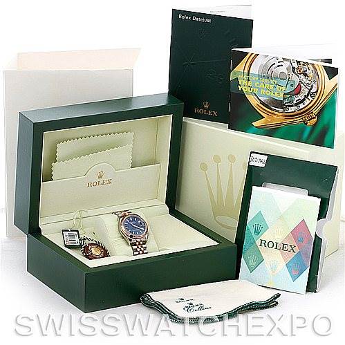 The watch is displayed in its Rolex box with accompanying accessories, manuals, and cloths; the model is a Mid-Size Rolex Datejust.
