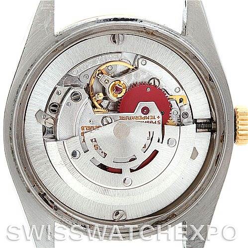 The image shows the back view of a Rolex Mid-Size 6827 Women's Stainless Steel White Dial 6827 Women's Stainless Steel White Dial model, highlighting its mechanical movement and inner components.