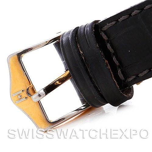 This image shows a close-up of the buckle and leather strap of a Mid-Size Rolex watch.