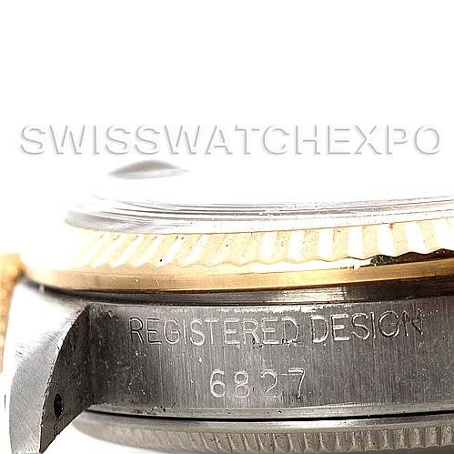This image shows a close-up of the bezel and case side of a Mid-Size Rolex watch, including the "REGISTERED DESIGN 6827" engraving.