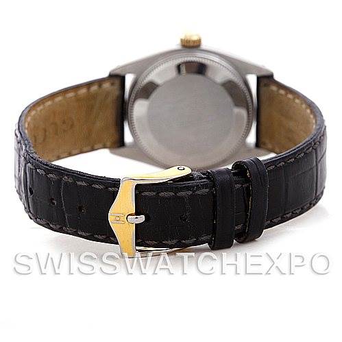 The image shows the back view of a Rolex Mid-Size 6827 Women's Stainless Steel White Dial 6827 Women's Stainless Steel White Dial watch highlighting the case back and leather strap with a gold-tone buckle.