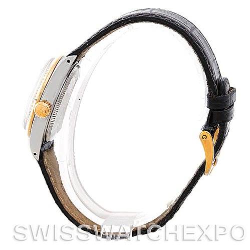 The image shows a side profile of a Rolex Mid-Size 6827 Women's Stainless Steel White Dial 6827 Women's Stainless Steel White Dial model watch, highlighting its case, crown, and leather strap with a gold buckle.