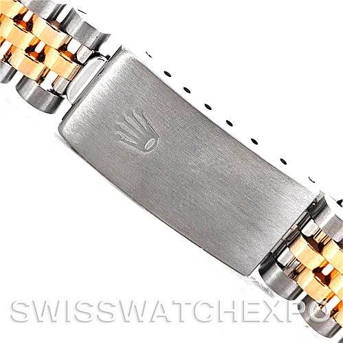 The image shows a close-up of the clasp and part of the bracelet of a Mid-Size Rolex watch.