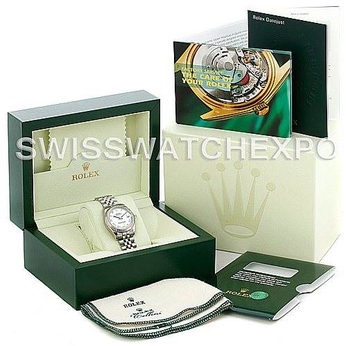 The image shows a Rolex Mid-Size 178274 Women
s Stainless Steel White Dial 178274 Women
s Stainless Steel White Dial model watch at a slight angle in its box, along with accessories including manuals, a cloth, and a card.