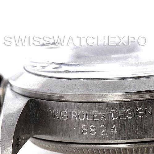The image shows a close-up of the case side detailing and serial number of a Mid-Size Rolex watch.