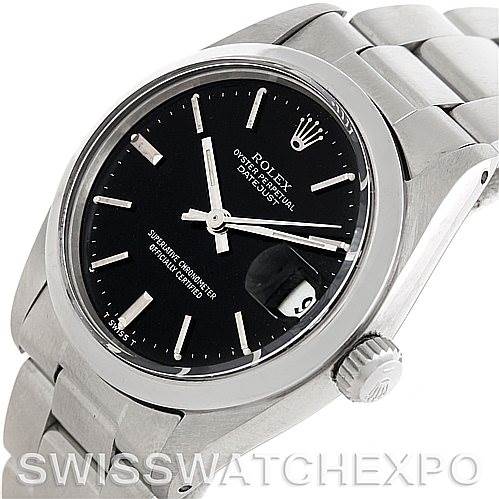 The image shows a close-up, angled view of a mid-size Rolex Oyster Perpetual Datejust, highlighting the dial, crown, and bracelet.