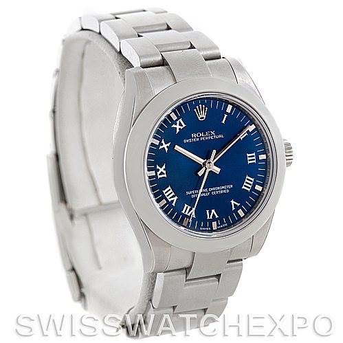 This image shows a Rolex Mid-Size 177200 Women's Stainless Steel Blue Dial 177200 Women's Stainless Steel Blue Dial Oyster Perpetual watch angled slightly from above, displaying the watch face, bezel, and part of the bracelet.
