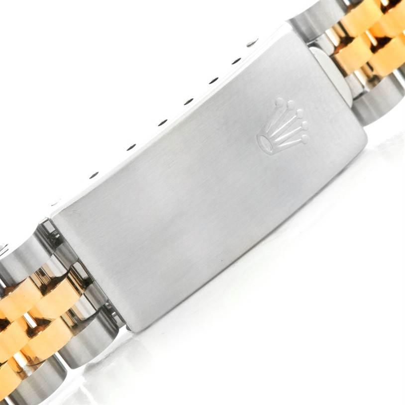 The image shows a close-up of the clasp of a Mid-Size Rolex watch, highlighting the dual-tone bracelet links.