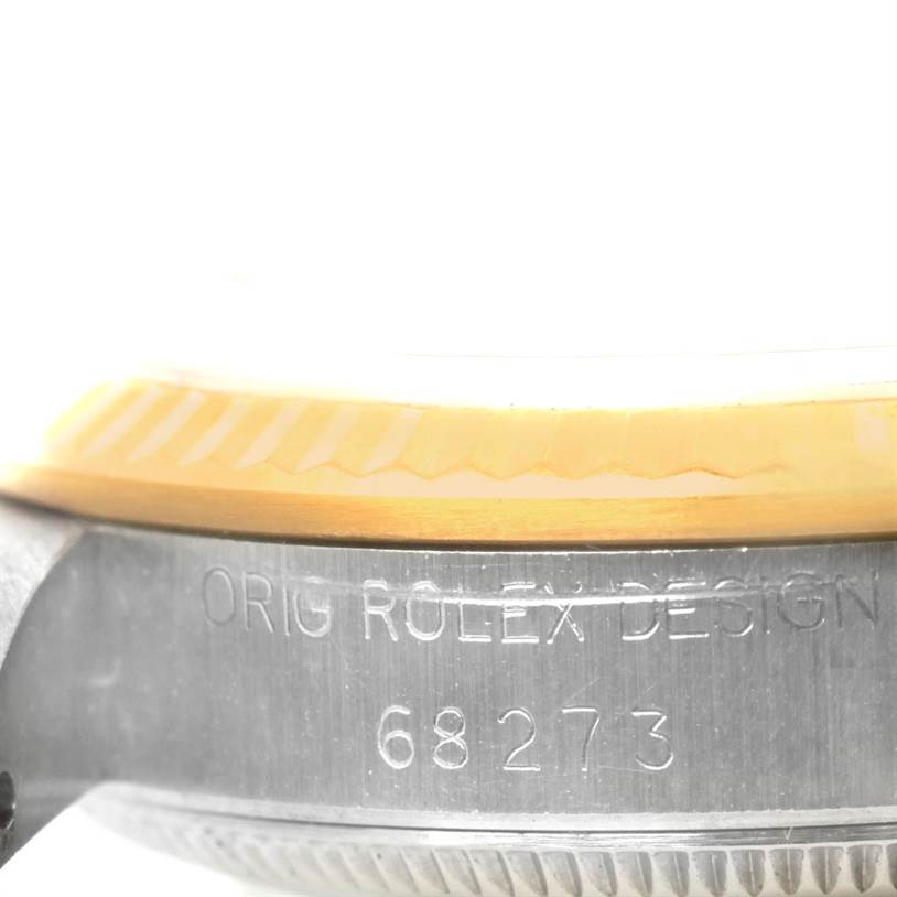 The image shows a close-up of the side view of a Rolex Mid-Size 68273 Women's Stainless Steel Black Dial 68273 Women's Stainless Steel Black Dial model watch, specifically the bezel and part of the case with the model number "68273."