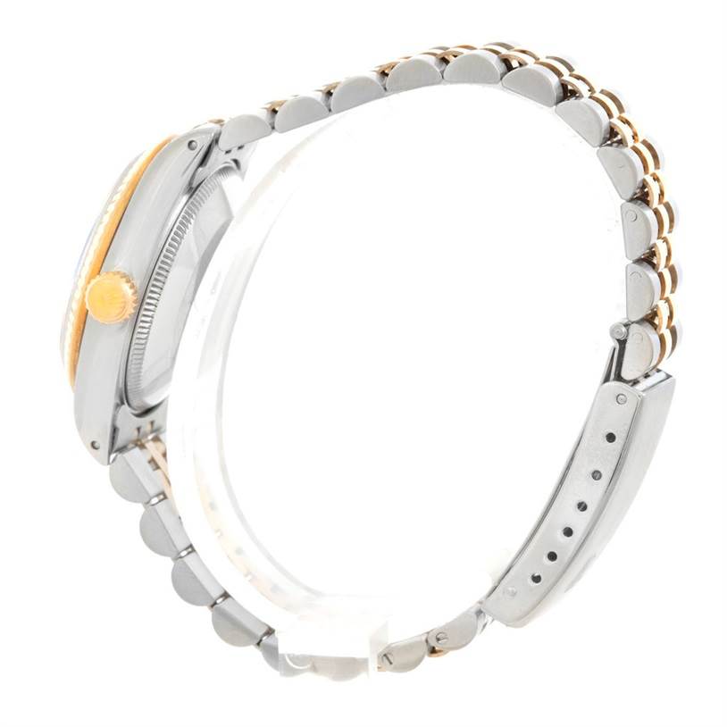 The image shows a side view of a Rolex Mid-Size 68273 Women's Stainless Steel Black Dial 68273 Women's Stainless Steel Black Dial model watch, highlighting the bracelet and crown.