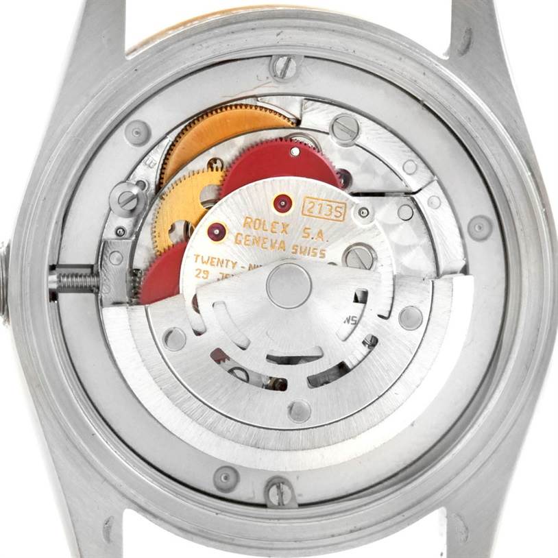 This image shows the inner mechanical workings of a Rolex Mid-Size 68273 Women's Stainless Steel Black Dial 68273 Women's Stainless Steel Black Dial watch, viewed from the back.