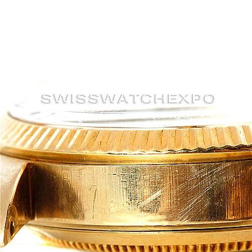 This image shows a side view of the case and bezel of a Rolex Mid-Size 6827 Women's Yellow Gold Silver Dial 6827 Women's Yellow Gold Silver Dial model watch.