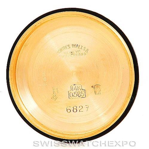 This image shows the inside case back of a Mid-Size Rolex watch, featuring engravings and hallmarks.