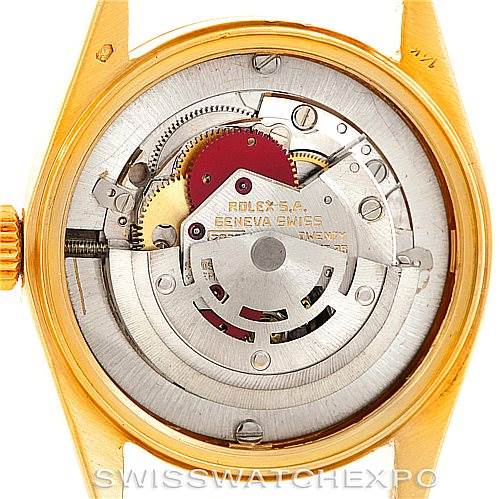 The image shows the back casing and intricate internal mechanisms of a Rolex Mid-Size 6827 Women's Yellow Gold Silver Dial 6827 Women's Yellow Gold Silver Dial model watch.
