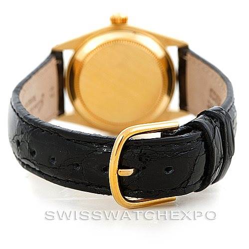 This image shows the back case and leather strap clasp of the Rolex Mid-Size 6827 Women's Yellow Gold Silver Dial 6827 Women's Yellow Gold Silver Dial watch.