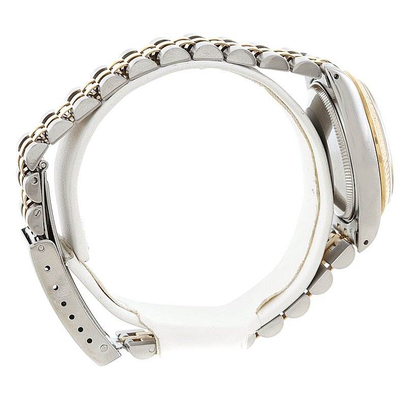 This image shows the side view of a Mid-Size Rolex watch, focusing on the band and the edge of the watch case.