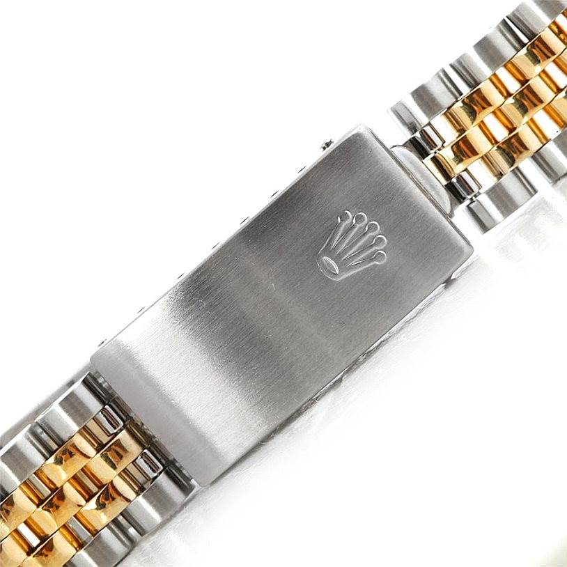 This image shows the clasp and part of the bracelet of a Mid-Size Rolex watch.