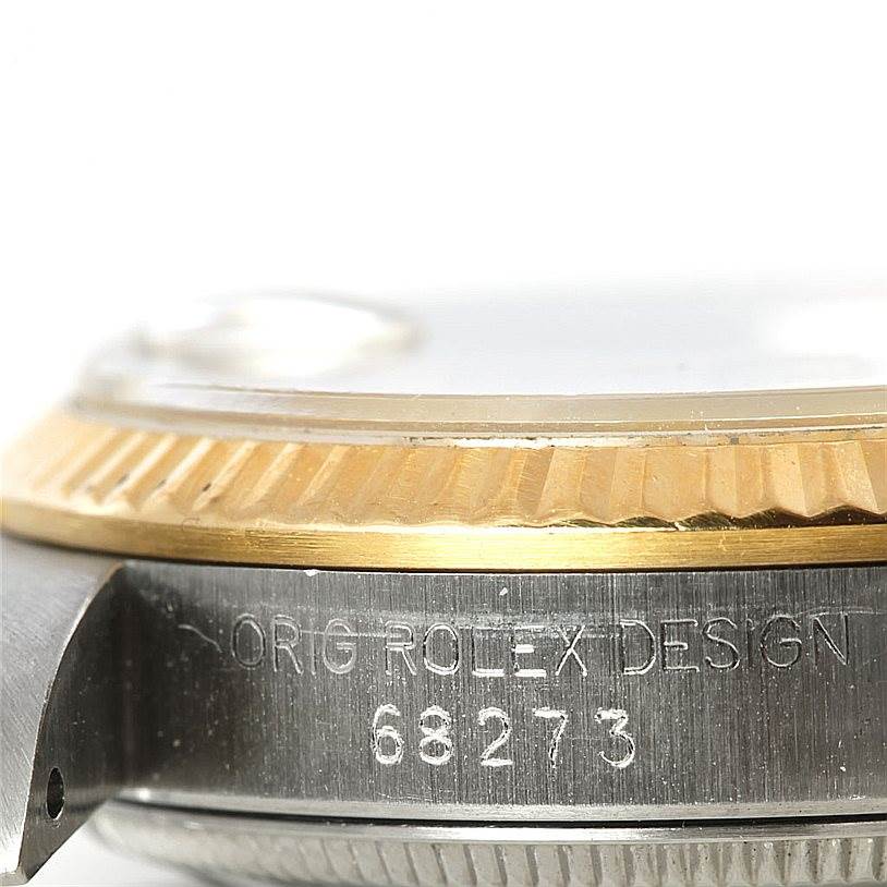 The image shows a close-up side view of the bezel and case side of a Mid-Size Rolex watch, highlighting the model number 68273.