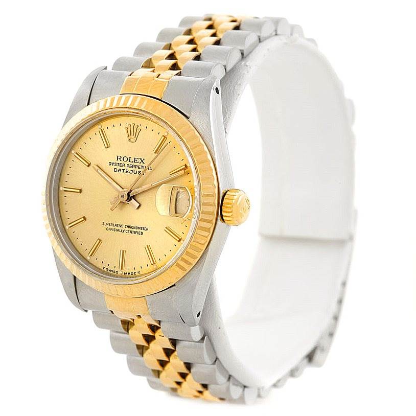 This is a side-angle view of a Rolex Mid-Size 68273 Women's Stainless Steel Champagne Dial 68273 Women's Stainless Steel Champagne Dial Datejust watch showcasing its gold and silver casing, bezel, and jubilee bracelet.