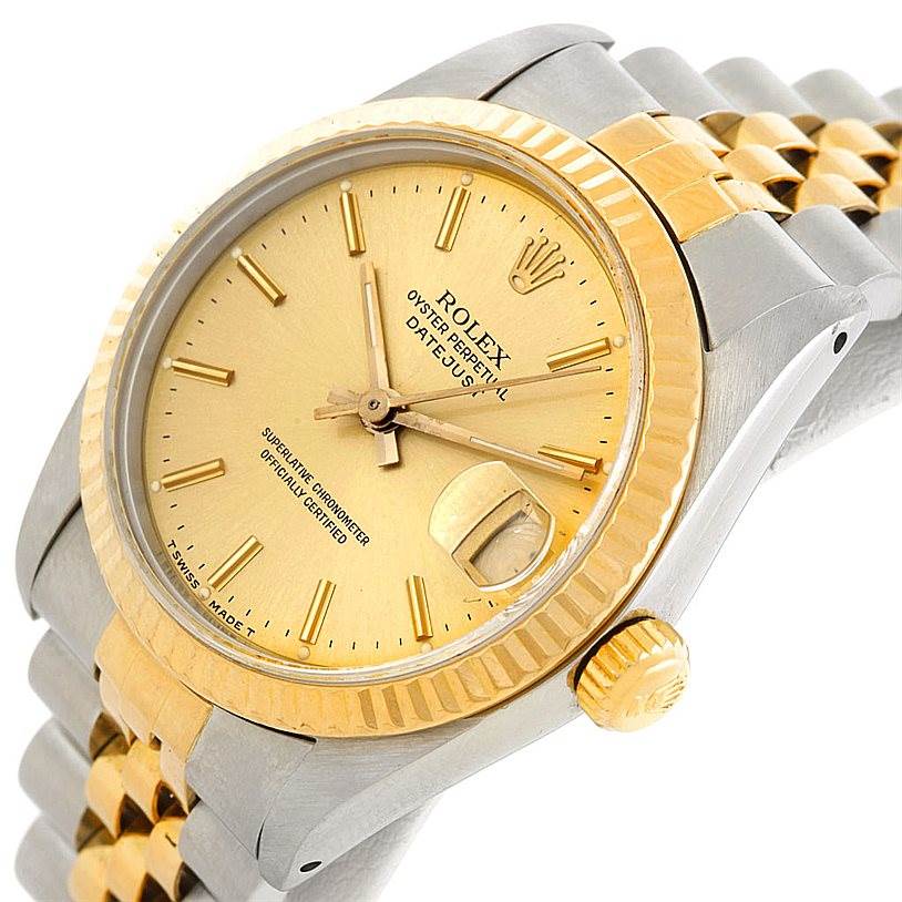 The image shows a close-up angle of a Rolex Mid-Size 68273 Women's Stainless Steel Champagne Dial 68273 Women's Stainless Steel Champagne Dial Oyster Perpetual Datejust, highlighting its gold dial, fluted bezel, and two-tone bracelet.