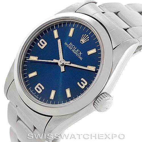 This image shows a Rolex Mid-Size 67480 Women's Stainless Steel Blue Dial 67480 Women's Stainless Steel Blue Dial Oyster Perpetual watch at a slight angle, highlighting its blue dial, crown, and stainless steel bracelet.