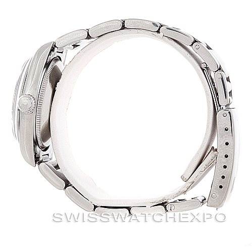 The image shows a side profile of the Rolex Mid-Size 67480 Women's Stainless Steel Blue Dial 67480 Women's Stainless Steel Blue Dial model, highlighting the case, bracelet, clasp, and crown.