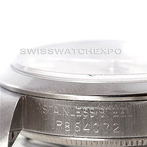 This image shows the side of a mid-size Rolex watch, displaying the stainless steel marking and serial number.