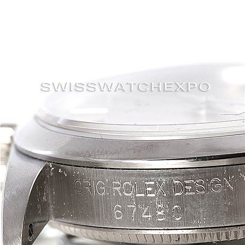 This image shows a close-up side view of the bezel and casing, including the model number engraving, of a Mid-Size Rolex watch.