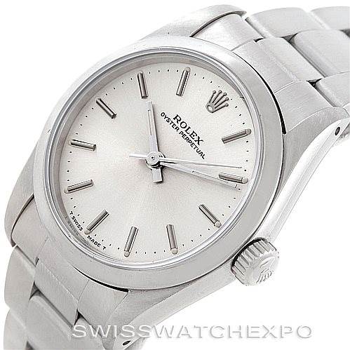 This image shows a Rolex Oyster Perpetual Mid-Size watch angled from the top right, highlighting the face, crown, and bracelet.