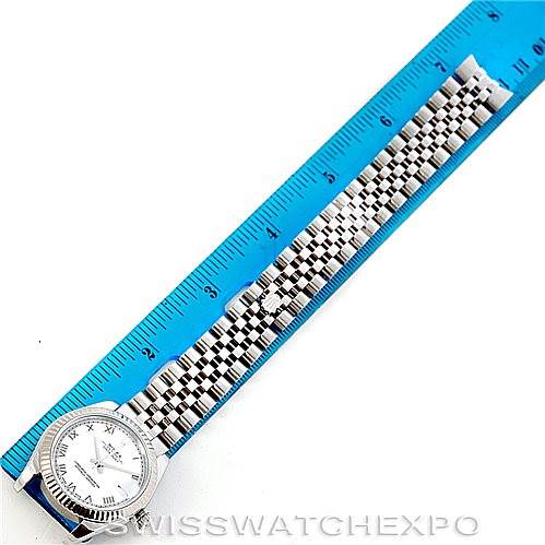 The image shows a face-on view of a Rolex Mid-Size 178274 Women's Stainless Steel White Dial 178274 Women's Stainless Steel White Dial model watch with its full bracelet extended next to a ruler measuring about 18 cm.